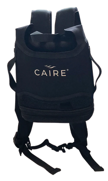 CAIRE FreeStyle Comfort backpack rear view showing padded shoulder straps waist buckle and mesh ventilation panel