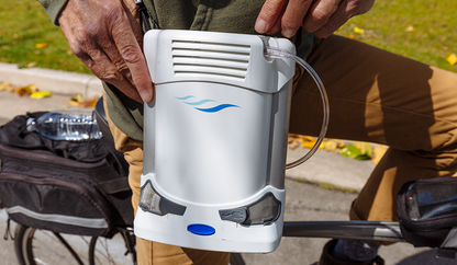 CAIRE Freestyle Comfort portable oxygen concentrator front view with shoulder strap