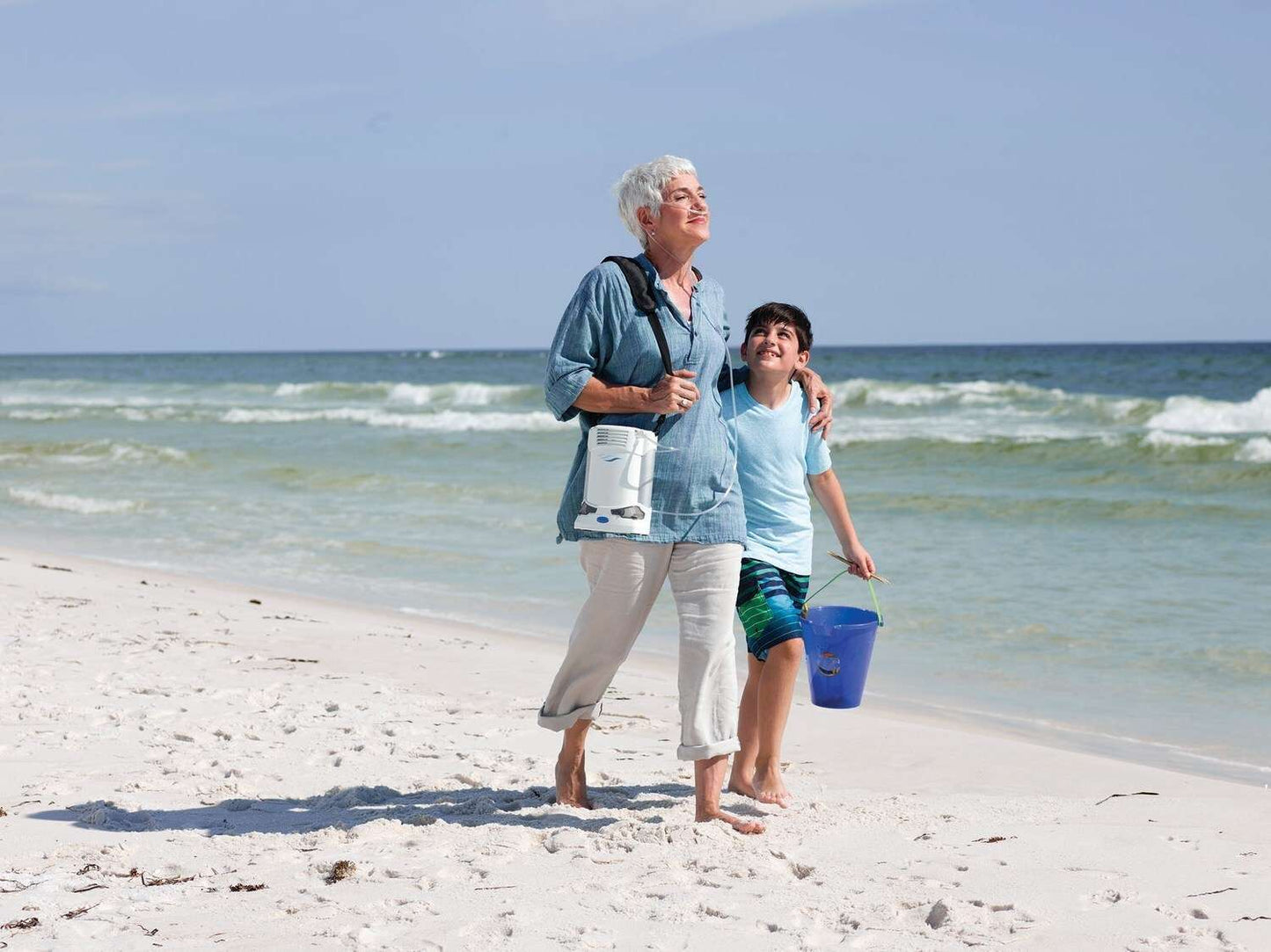 CAIRE Freestyle Comfort portable oxygen concentrator in use lifestyle shot