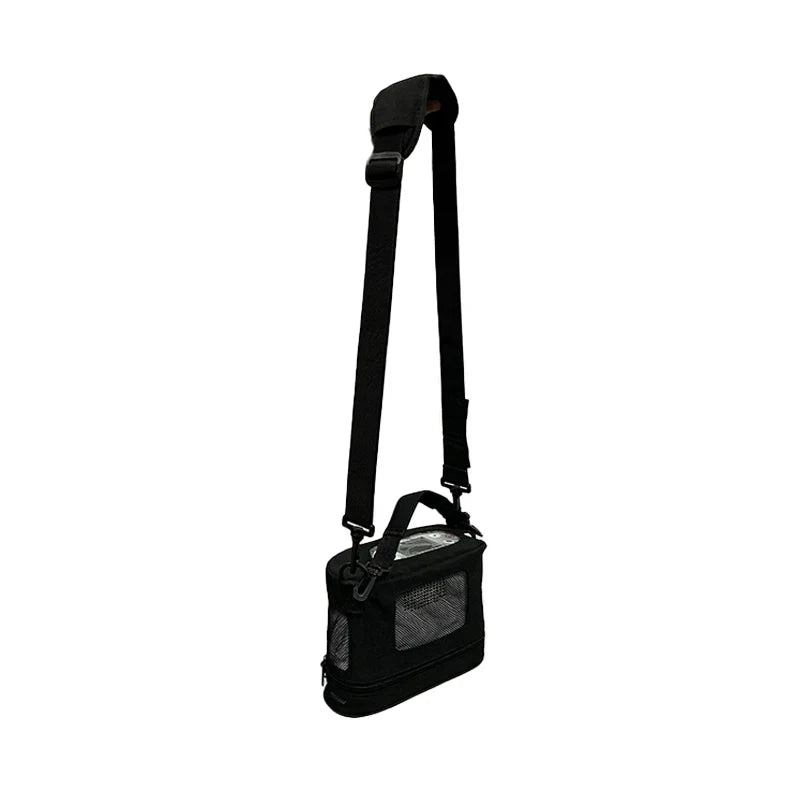 Black Kingon P2-E carry bag with mesh side panel, hanging from its adjustable padded shoulder strap