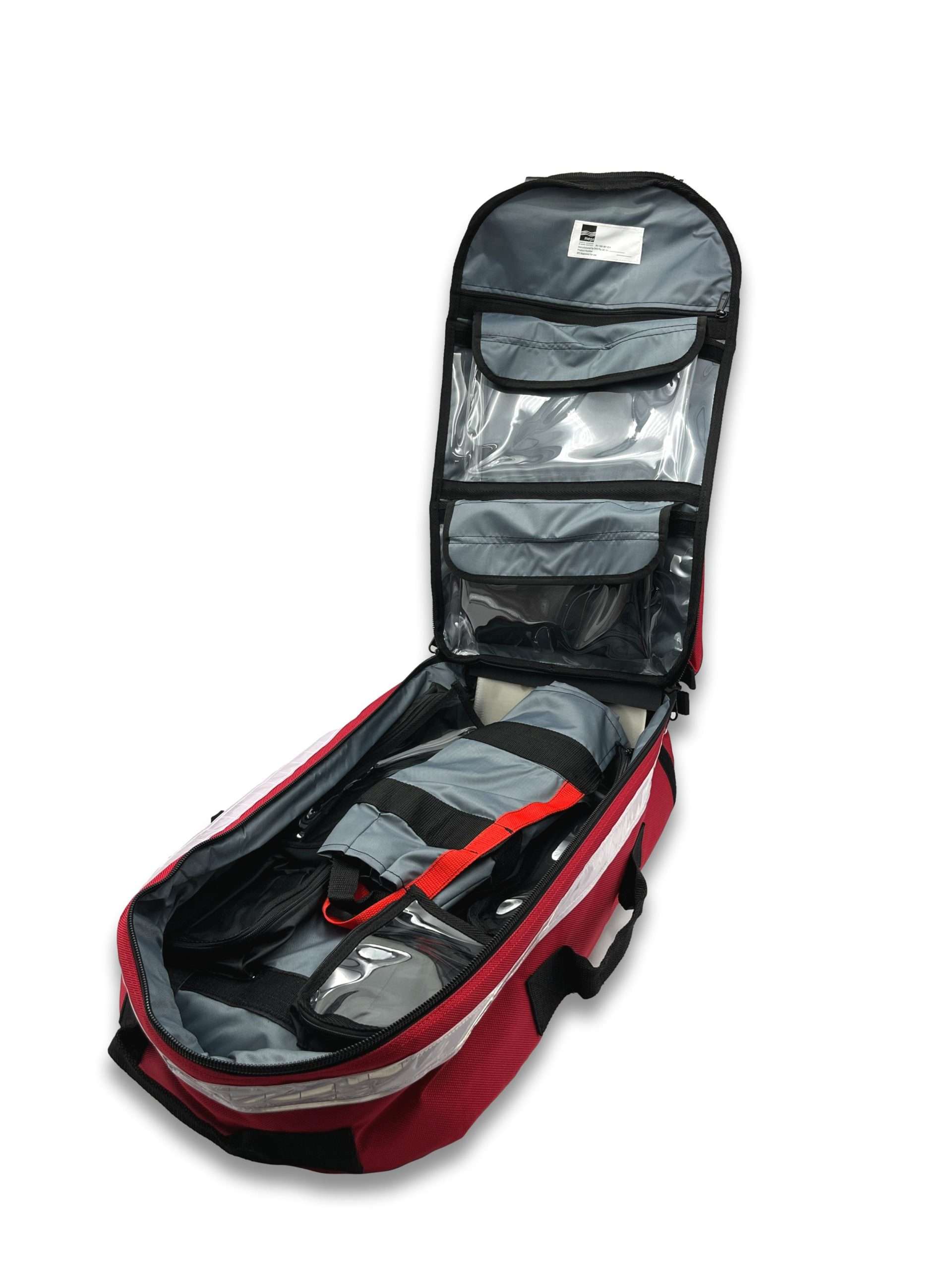 Big Red resuscitation kit open showing clear-window internal pouches on lid and main equipment compartment with reflective tape