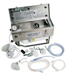 Comweld Oxy-Viva 3 resuscitator kit open stainless steel case showing demand valve, suction canister, pressure gauge and full kit contents